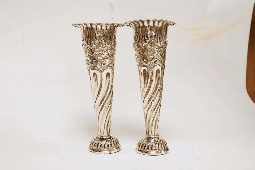 A pair of Edwardian silver spill vases, by S.W. Smith & Co, London, 1905, height 16.1cm, weighted, one split. Condition - poor